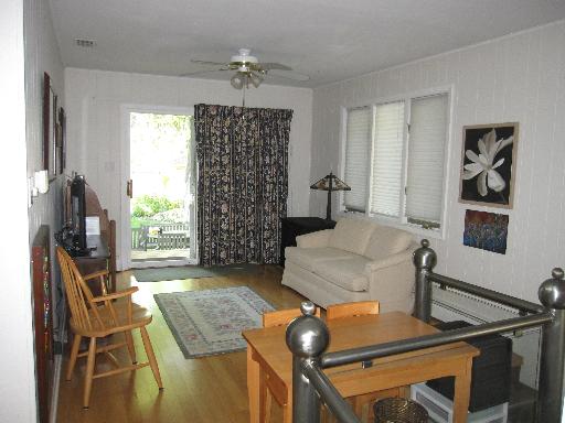 336 Olmsted Road Riverside, IL 60546 - Photo 8 of 12 a living room with furniture and a flat screen tv