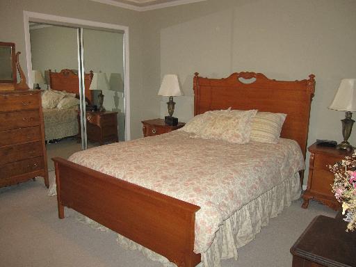 336 Olmsted Road Riverside, IL 60546 - Photo 9 of 12 a large bed sitting in a bedroom next to a cabinet