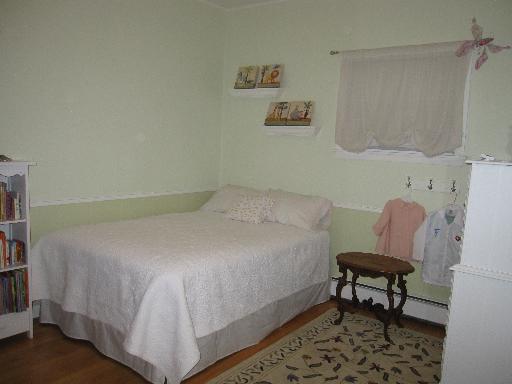 336 Olmsted Road Riverside, IL 60546 - Photo 10 of 12 a bedroom with a bed and a chair