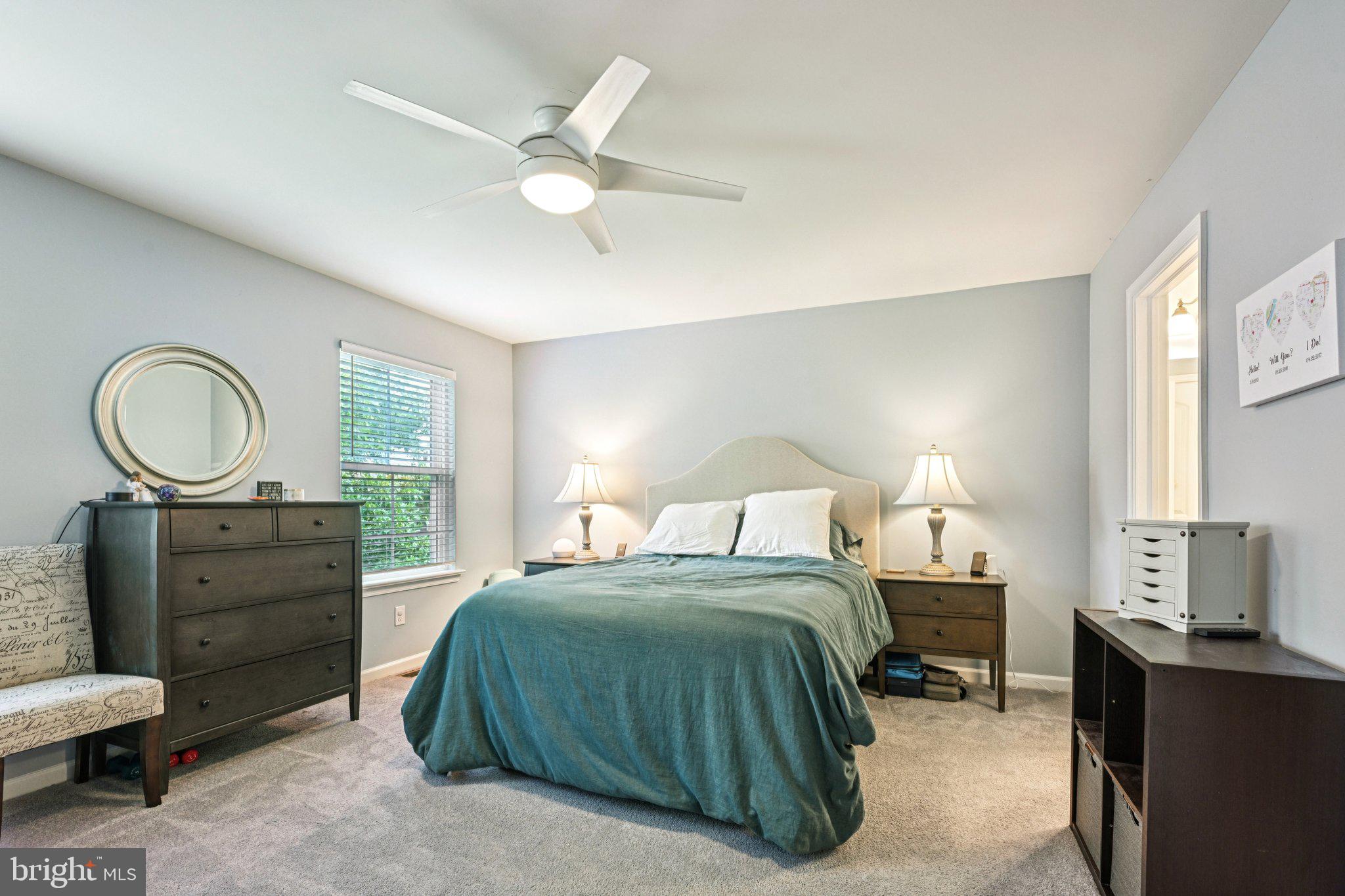 400 North York Road, Unit D Hatboro, PA 19040 - Photo 23 of 48 a bedroom with a bed and a chandelier