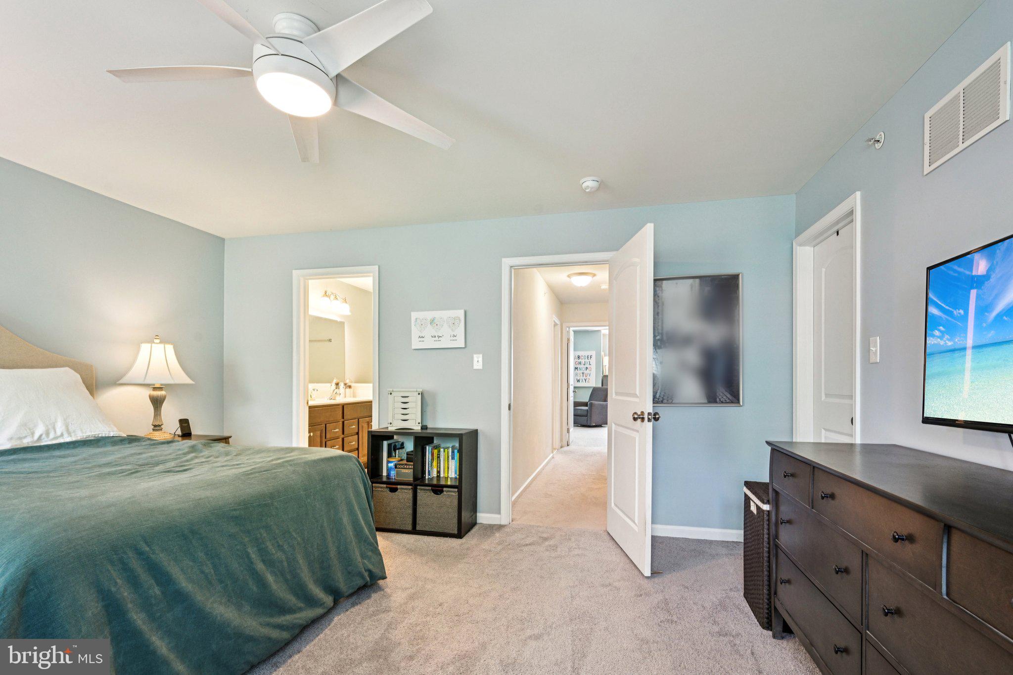 400 North York Road, Unit D Hatboro, PA 19040 - Photo 26 of 48 a bedroom with a bed and a chandelier