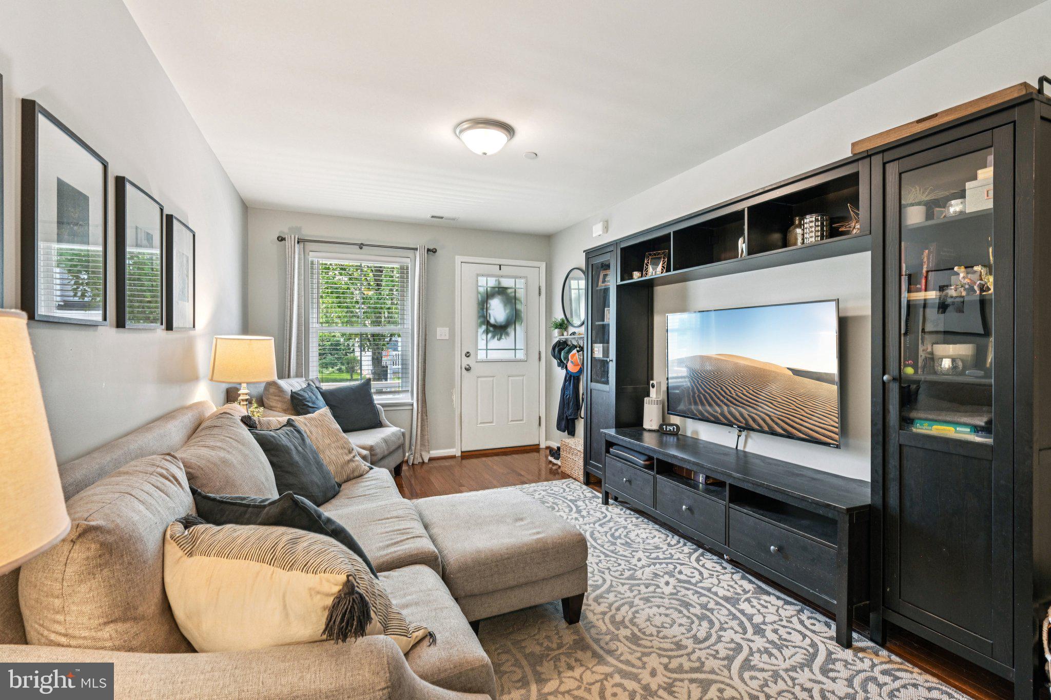 400 North York Road, Unit D Hatboro, PA 19040 - Photo 5 of 48 a living room with furniture and a flat screen tv