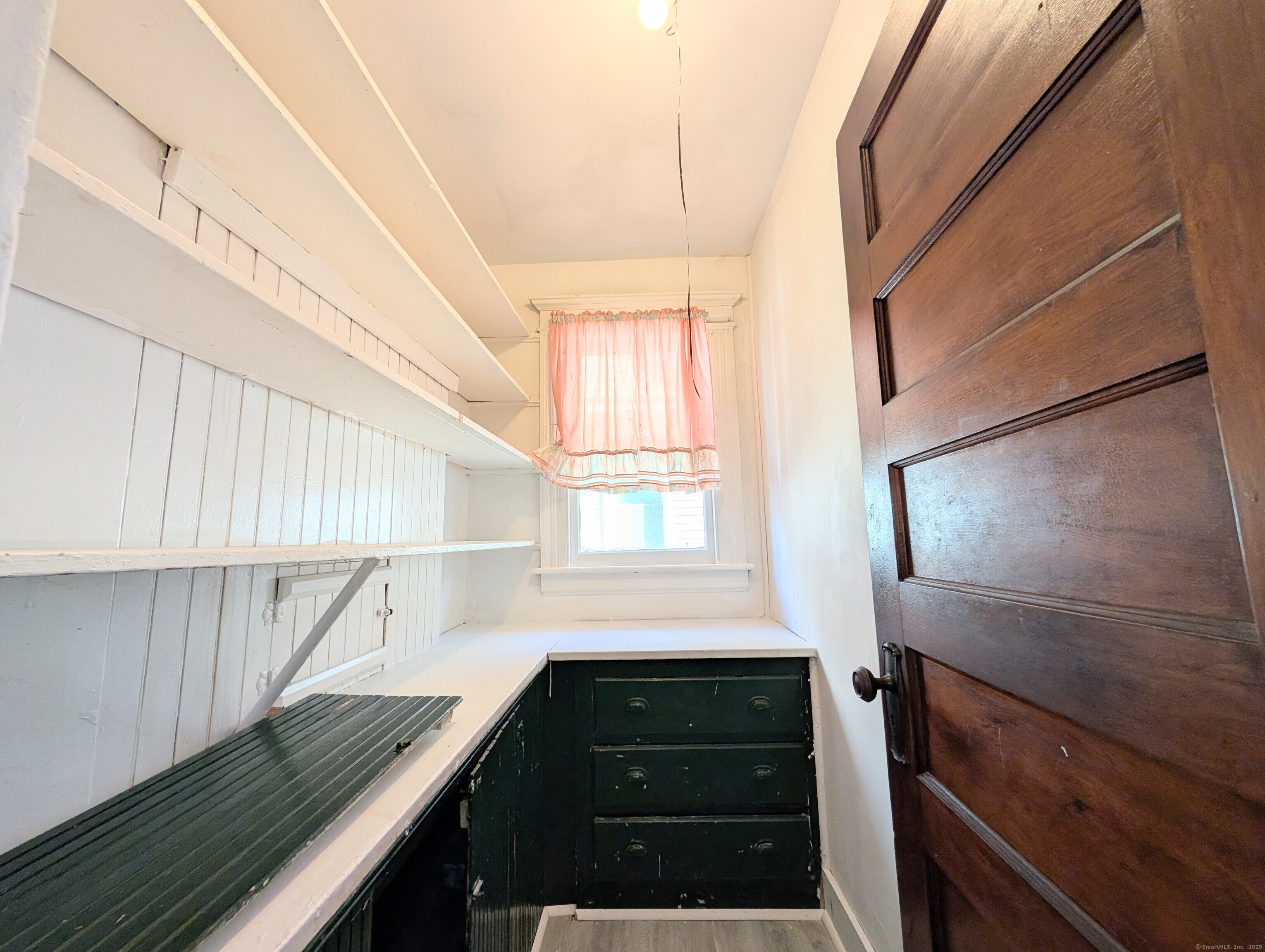 133 Poplar Street Bridgeport, CT 06605 - Photo 22 of 36 a bathroom with a sink a mirror and a window