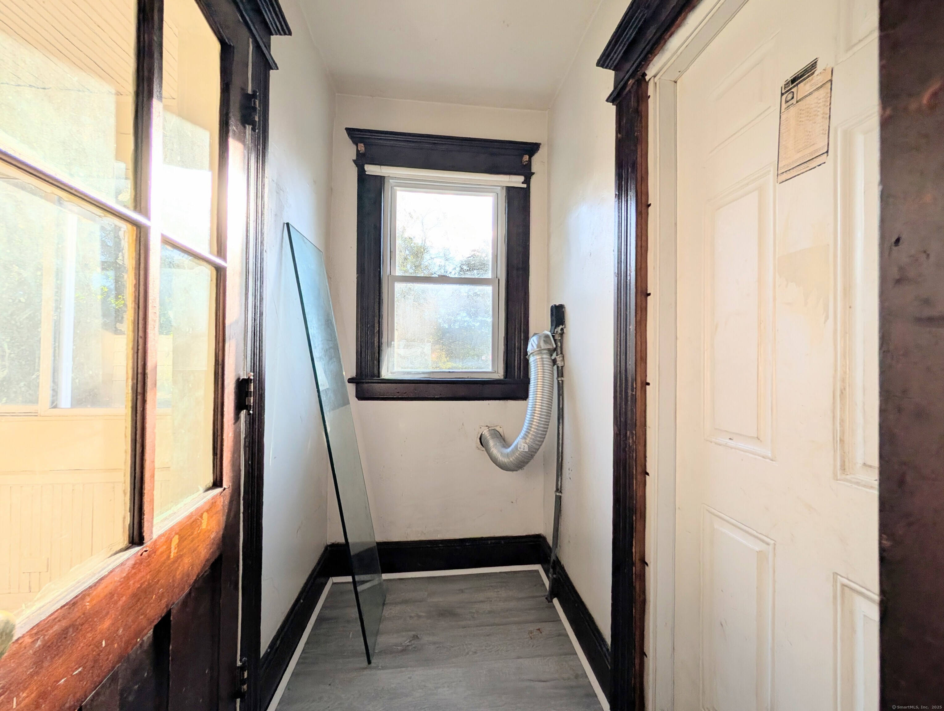 133 Poplar Street Bridgeport, CT 06605 - Photo 25 of 36 a view of an entryway with a mirror