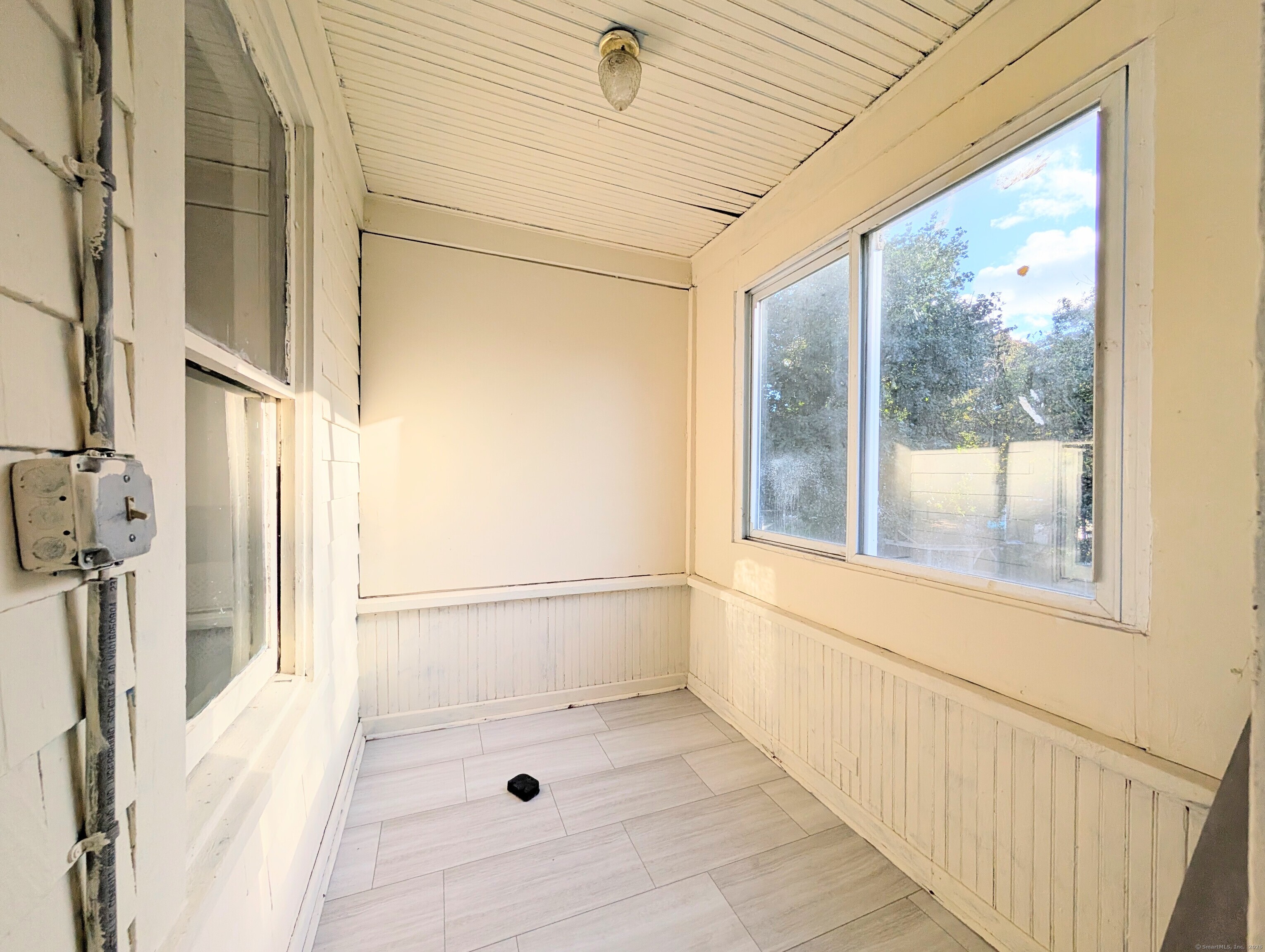 133 Poplar Street Bridgeport, CT 06605 - Photo 26 of 36 a bathroom with a window and a shower