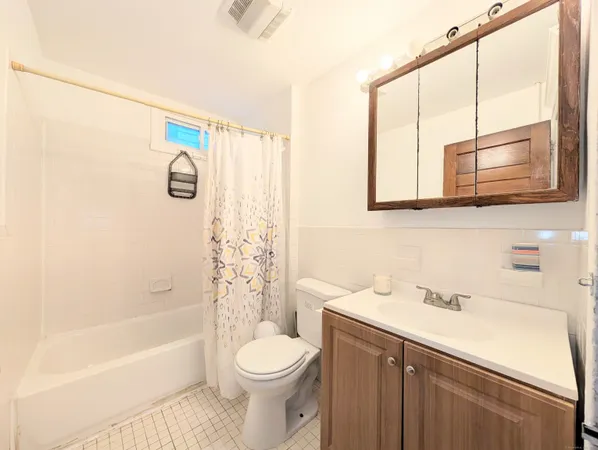 a bathroom with a sink a toilet and a bathtub