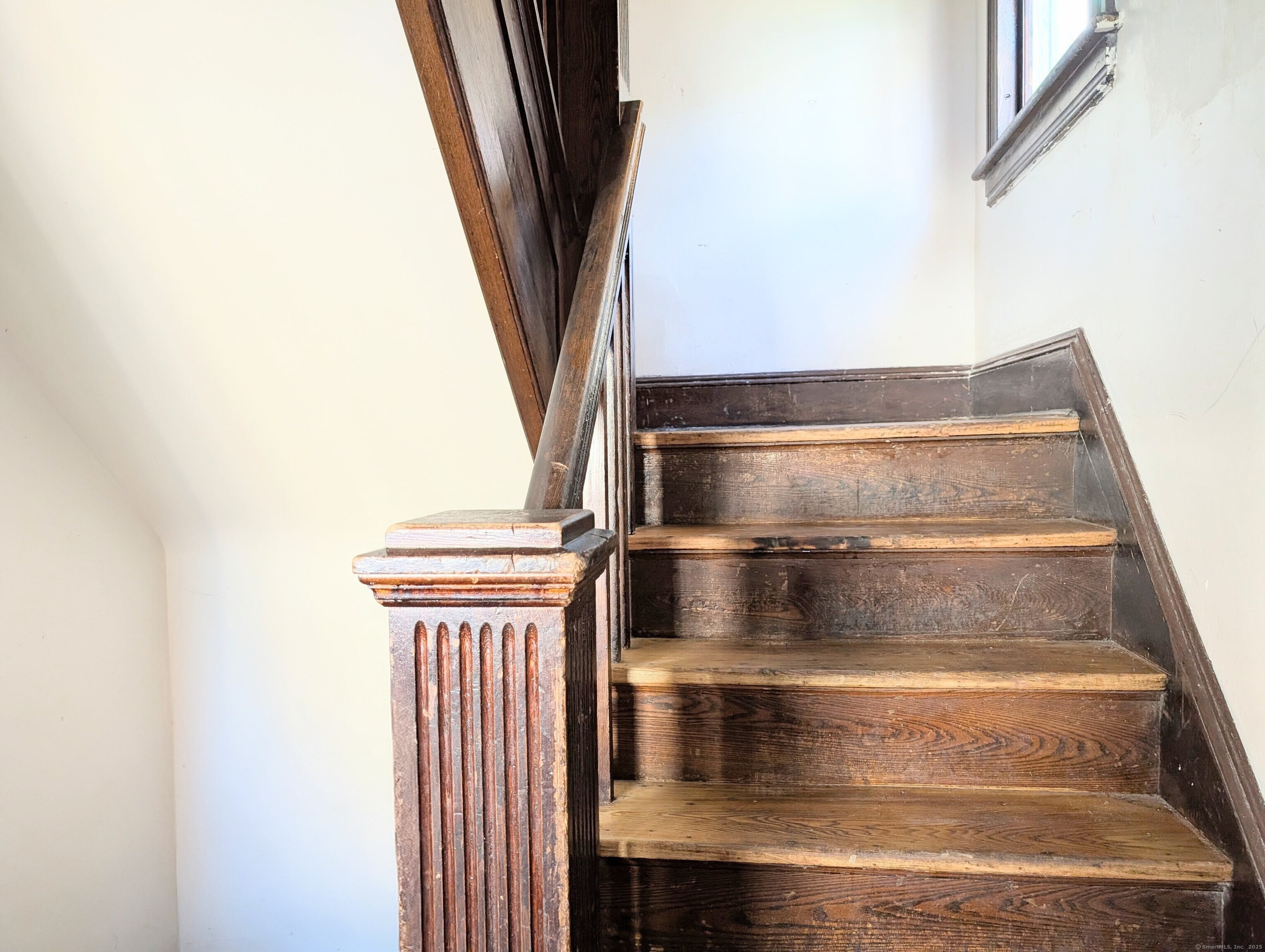 133 Poplar Street Bridgeport, CT 06605 - Photo 4 of 36 a view of staircase with white walls