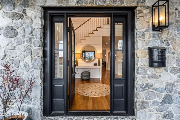 a view of entryway with wooden floor
