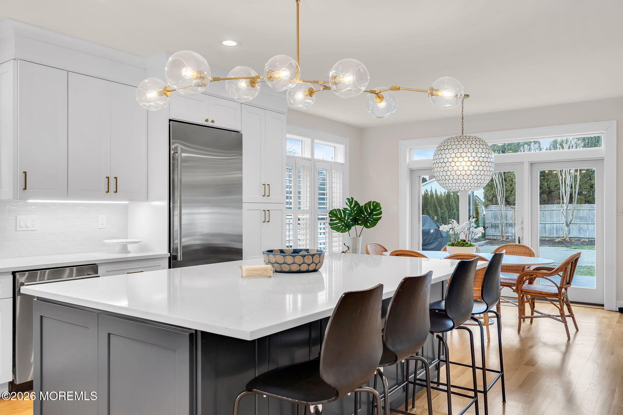 208 Salem Avenue Spring Lake, NJ 07762 - Photo 27 of 102 a dining room with furniture a chandelier and kitchen view