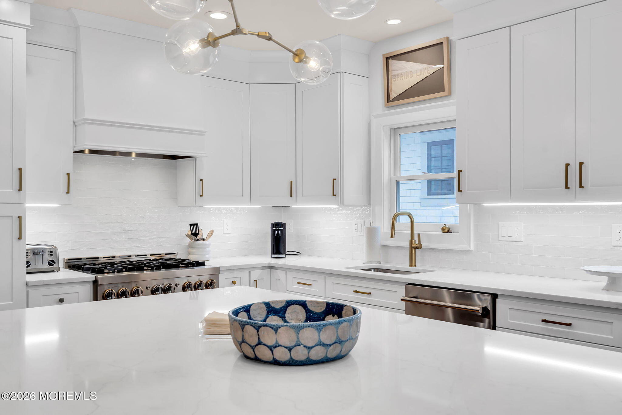 208 Salem Avenue Spring Lake, NJ 07762 - Photo 31 of 102 a kitchen with kitchen island granite countertop stainless steel appliances a stove a sink a refrigerator and cabinets