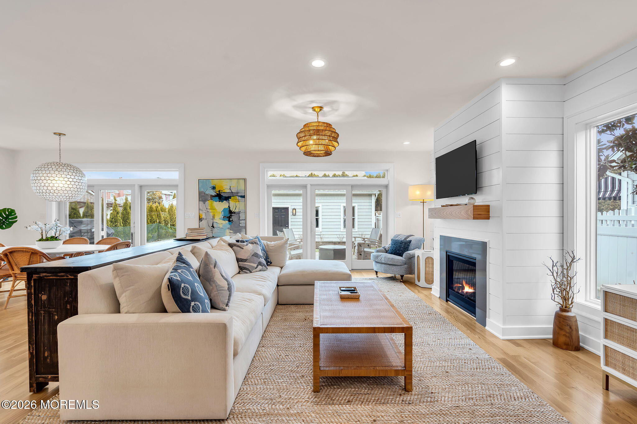 208 Salem Avenue Spring Lake, NJ 07762 - Photo 39 of 102 a living room with furniture a fireplace and a flat screen tv