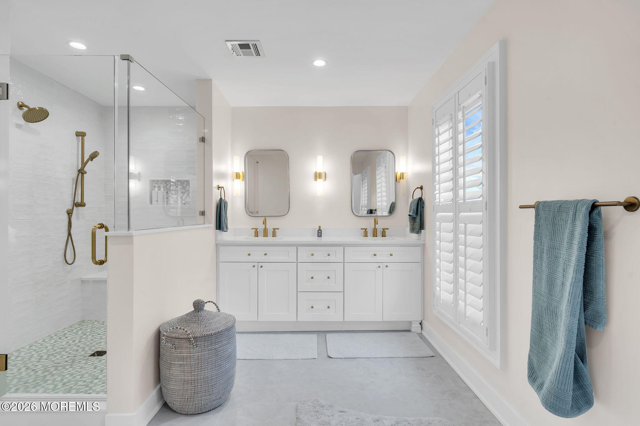 208 Salem Avenue Spring Lake, NJ 07762 - Photo 53 of 102 a spacious bathroom with a double vanity sink shower and a mirror