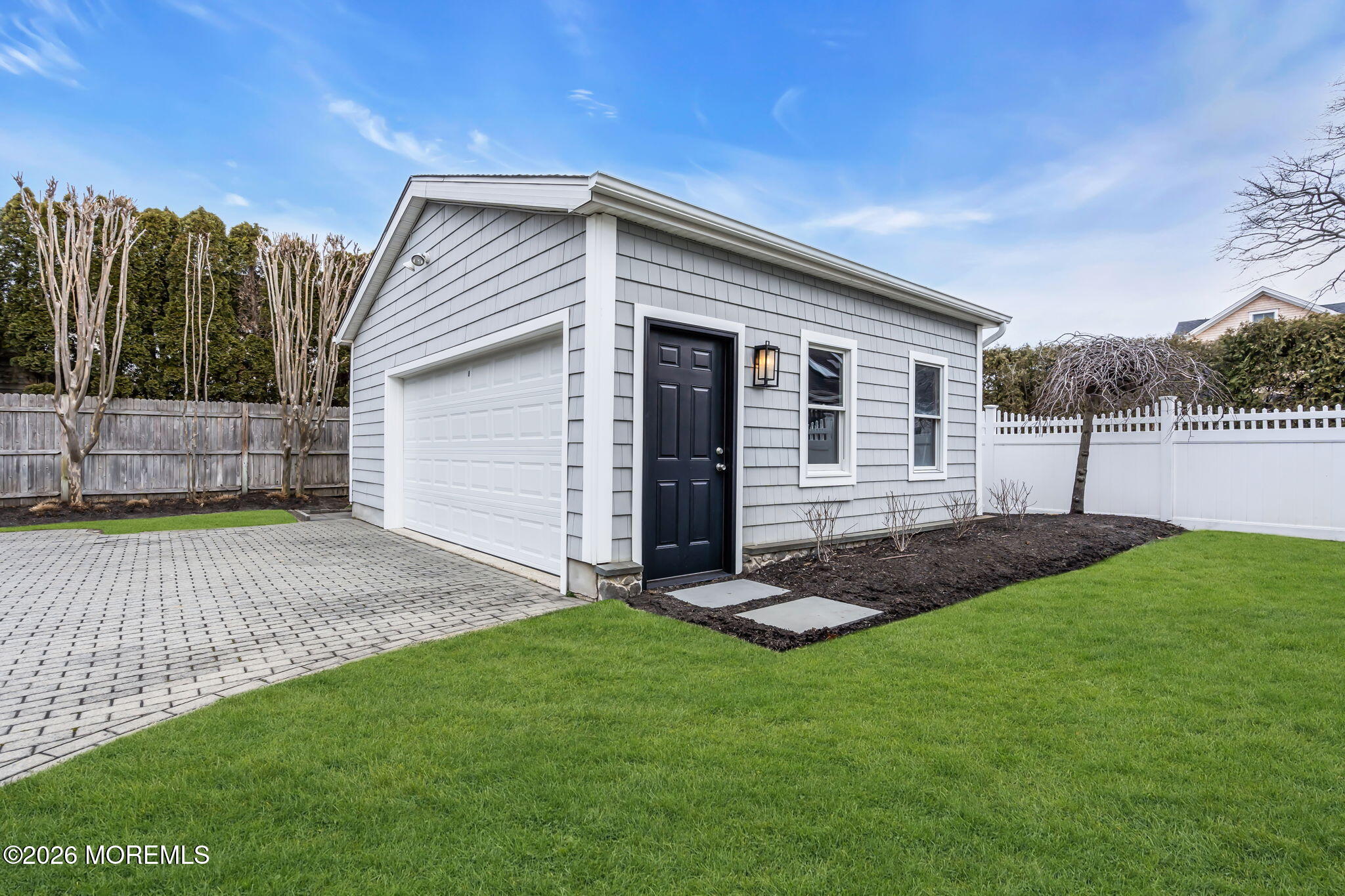 208 Salem Avenue Spring Lake, NJ 07762 - Photo 90 of 102 a view of a backyard with table and chairs with wooden fence