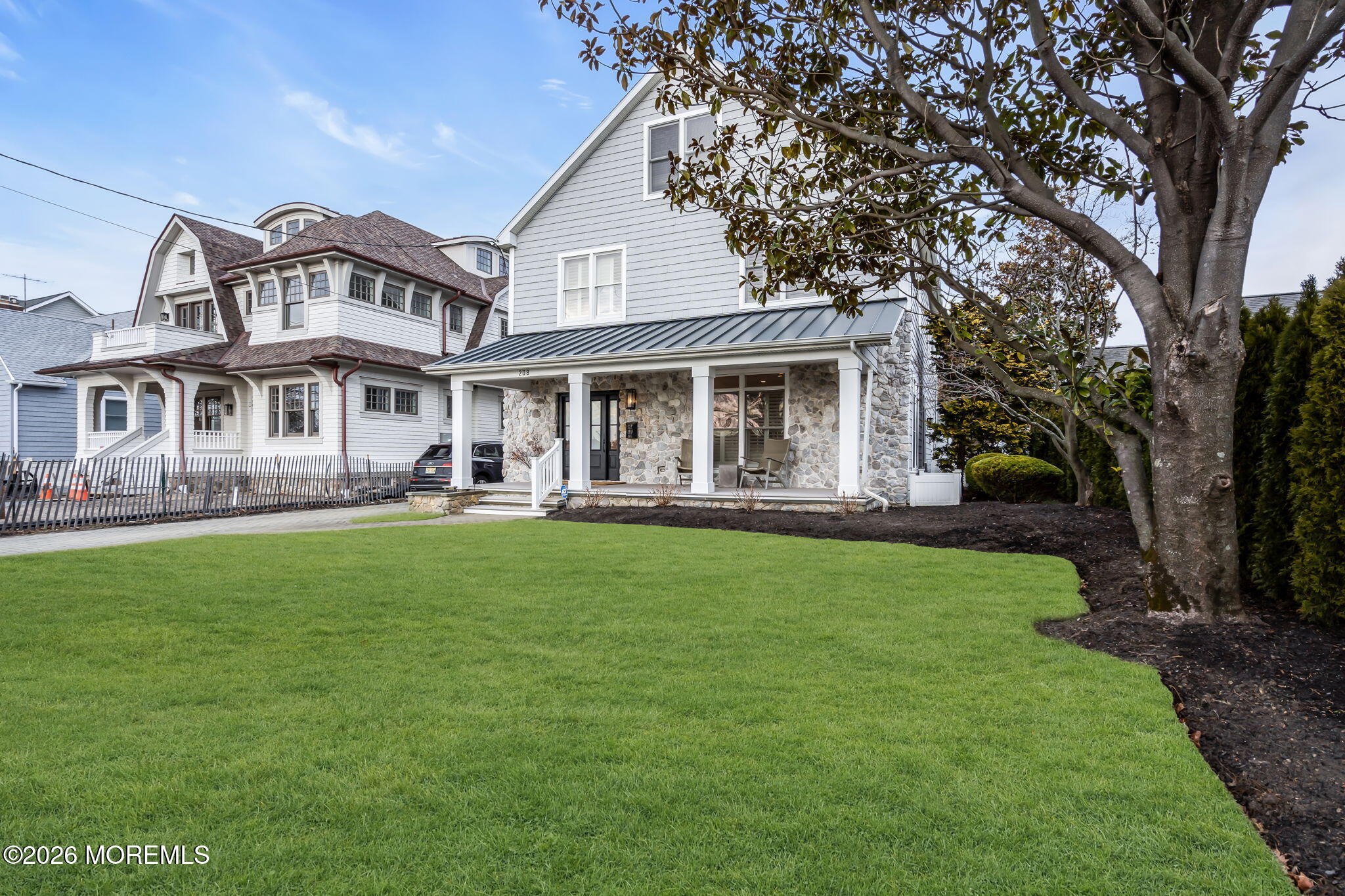 208 Salem Avenue Spring Lake, NJ 07762 - Photo 96 of 102 a front view of a house with a yard table and chairs