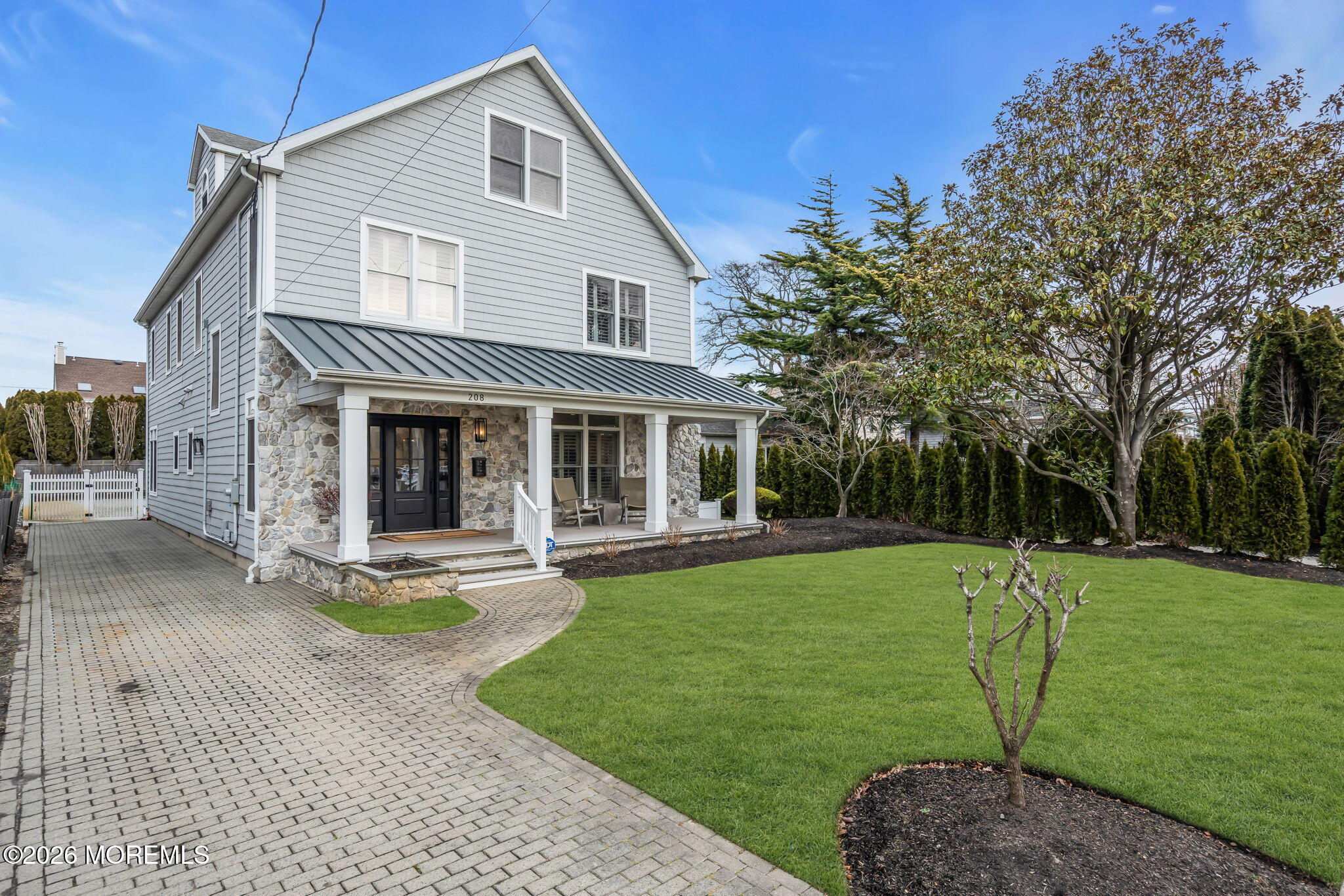 208 Salem Avenue Spring Lake, NJ 07762 - Photo 98 of 102 a front view of a house with a yard and porch