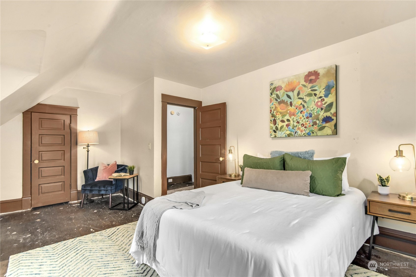 2215 Rockefeller Avenue Everett, WA 98201 - Photo 16 of 28 a bedroom with a bed and wooden floor