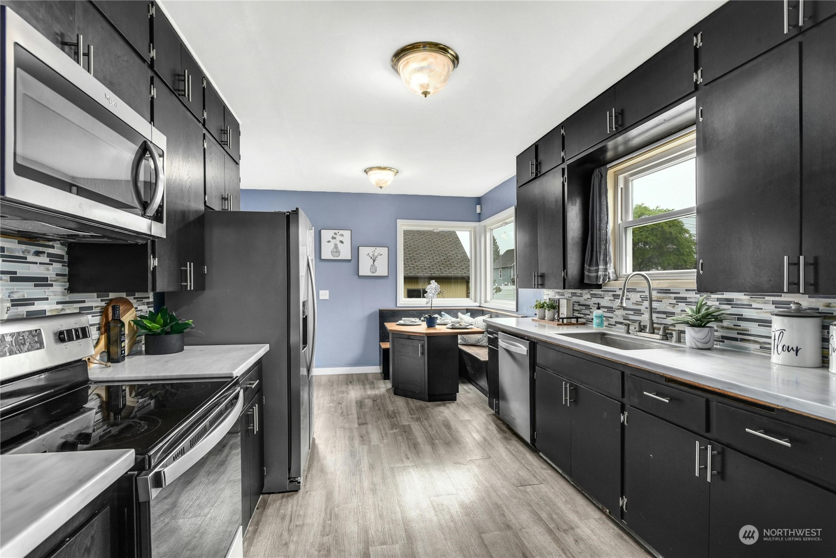 2215 Rockefeller Avenue Everett, WA 98201 - Photo 7 of 28 a kitchen with lots of counter top space and stainless steel appliances