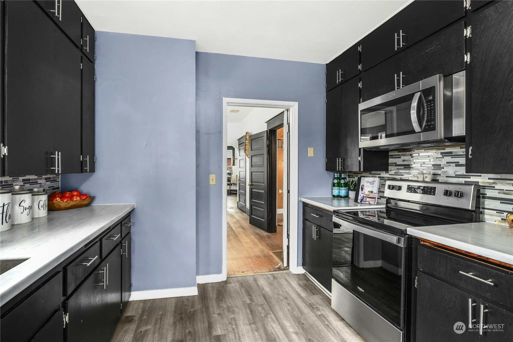 2215 Rockefeller Avenue Everett, WA 98201 - Photo 10 of 28 a kitchen with stainless steel appliances a sink stove and cabinets