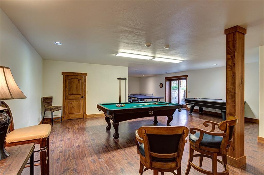 22 Braddock Drive Breckenridge, CO 80424 - Photo 12 of 35 a living room with furniture a piano and wooden floor