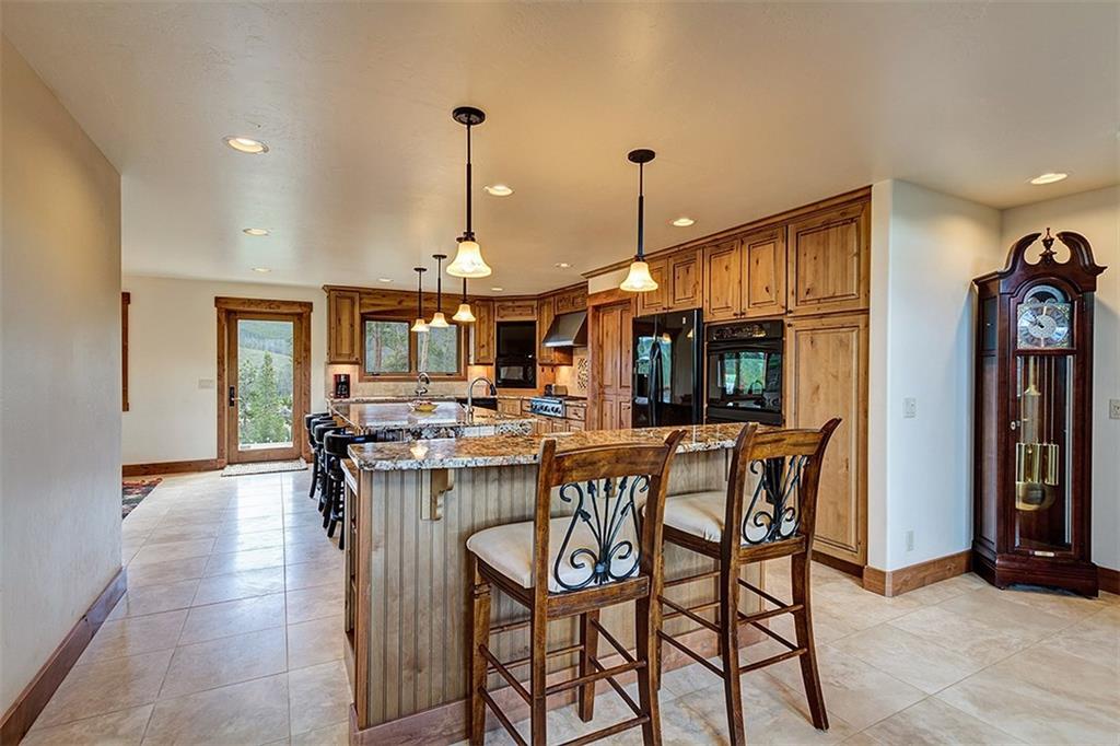 22 Braddock Drive Breckenridge, CO 80424 - Photo 16 of 35 a view of a dining room with furniture window and wooden floor