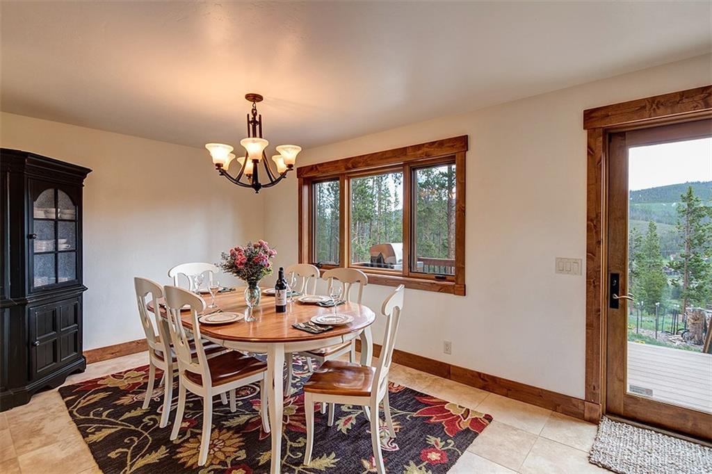 22 Braddock Drive Breckenridge, CO 80424 - Photo 17 of 35 a dining room with furniture a chandelier and window