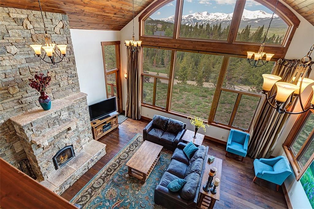 22 Braddock Drive Breckenridge, CO 80424 - Photo 23 of 35 a living room with furniture and a floor to ceiling window