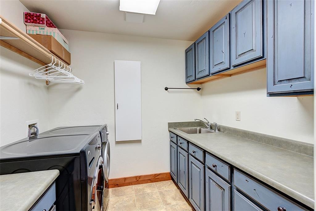 22 Braddock Drive Breckenridge, CO 80424 - Photo 26 of 35 a kitchen with a sink cabinets and stainless steel appliances