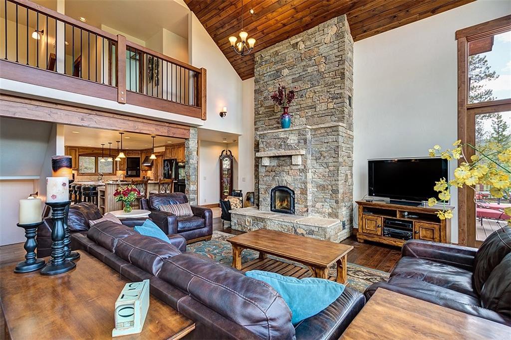 22 Braddock Drive Breckenridge, CO 80424 - Photo 4 of 35 a living room with furniture and a flat screen tv