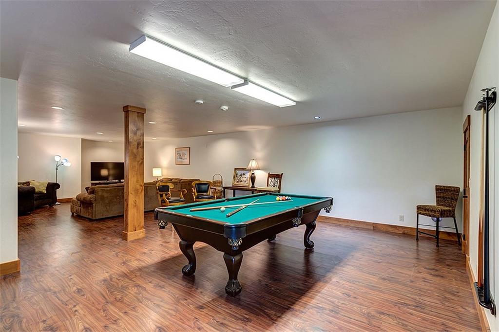 22 Braddock Drive Breckenridge, CO 80424 - Photo 31 of 35 a room with furniture and wooden floor