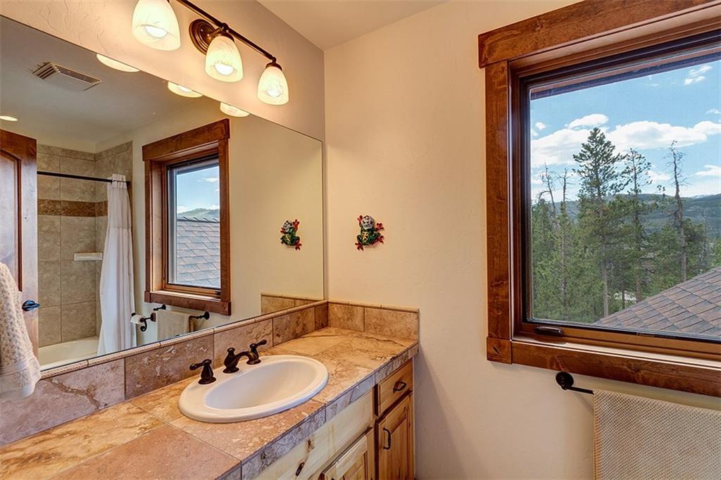 22 Braddock Drive Breckenridge, CO 80424 - Photo 33 of 35 a bathroom with a sink and a mirror