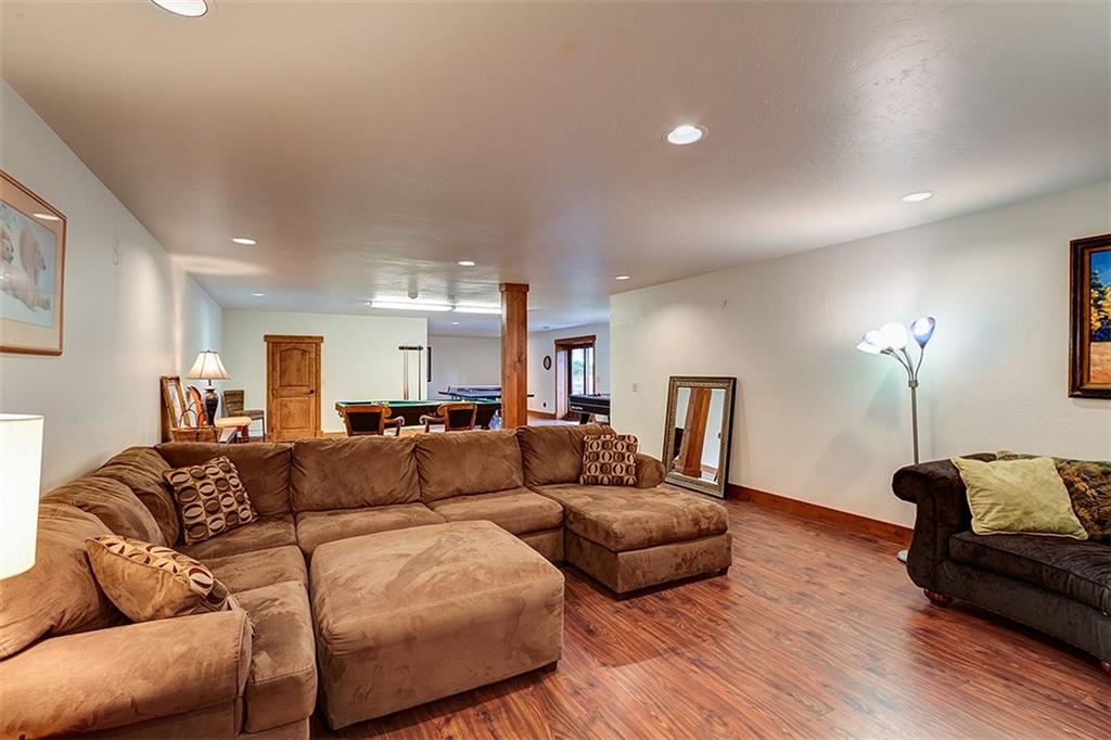 22 Braddock Drive Breckenridge, CO 80424 - Photo 34 of 35 a living room with furniture and a wooden floor