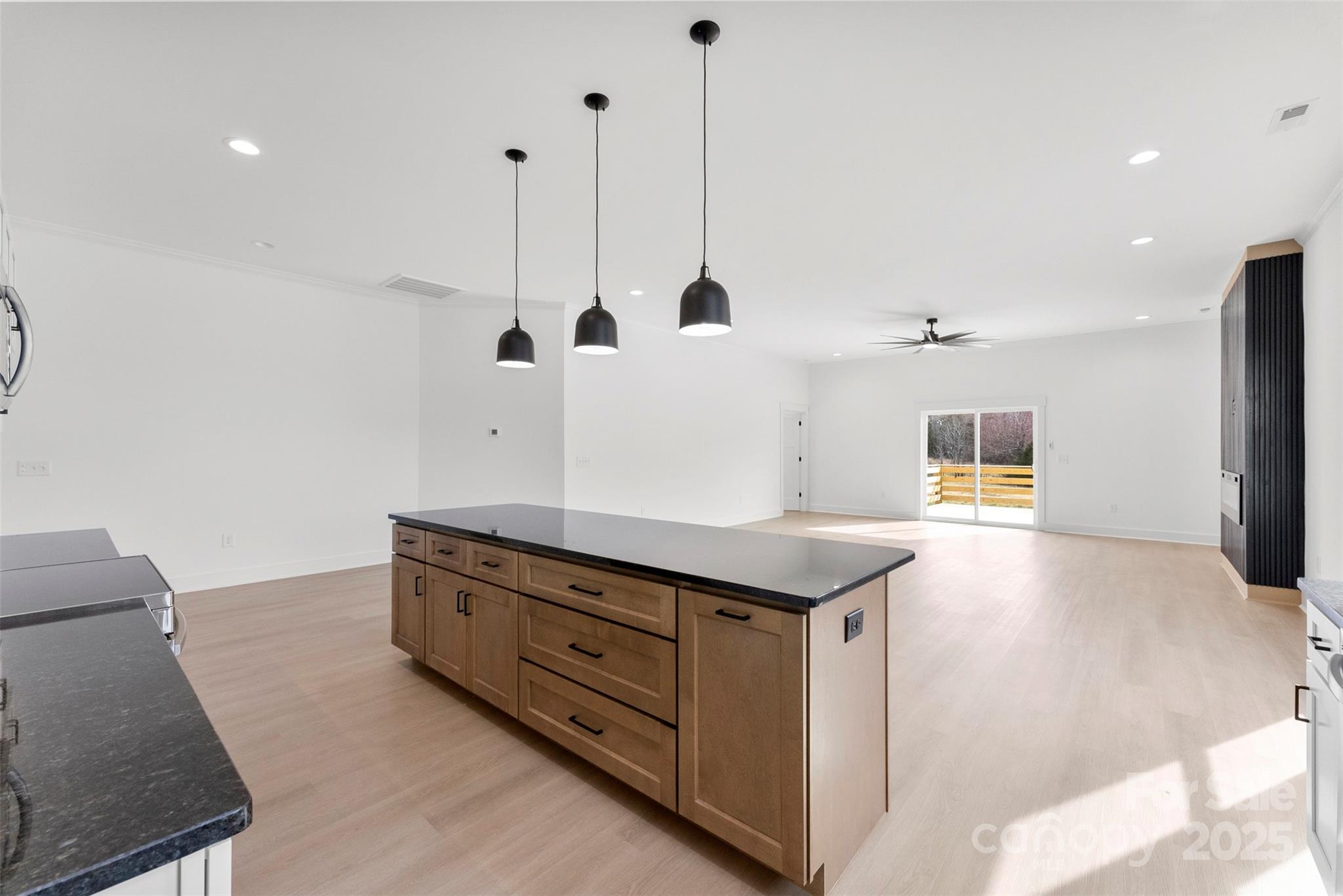 4085 Miller Road Salisbury, NC 28147 - Photo 12 of 46 a kitchen with a stove and a wooden floor