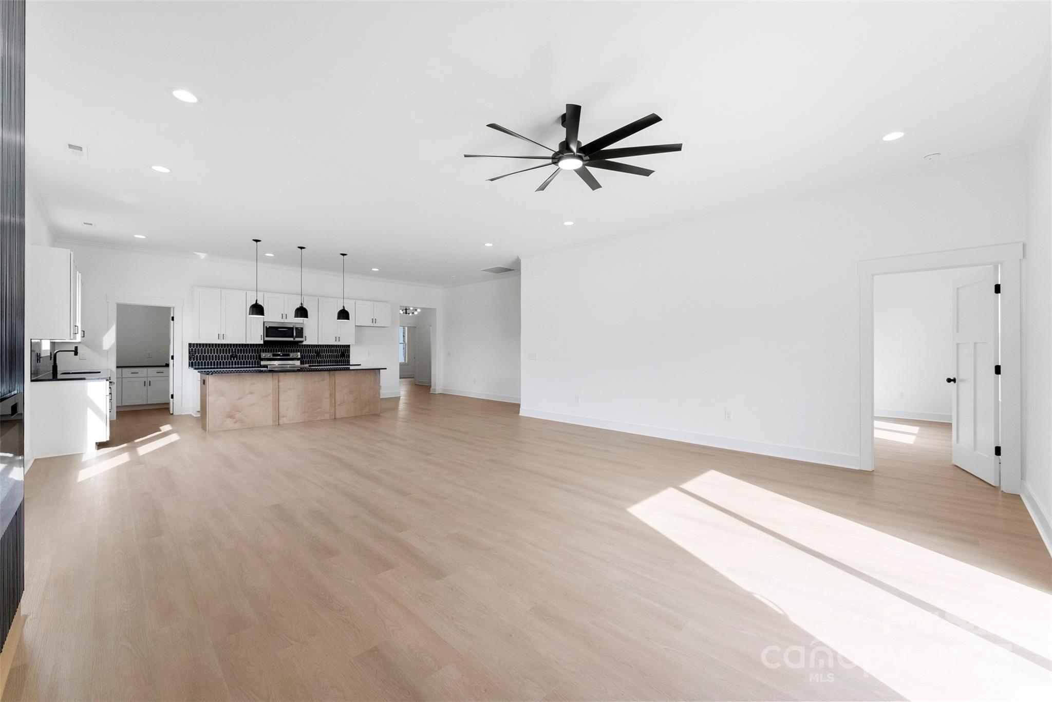 4085 Miller Road Salisbury, NC 28147 - Photo 19 of 46 a view of a living room a window and a ceiling fan