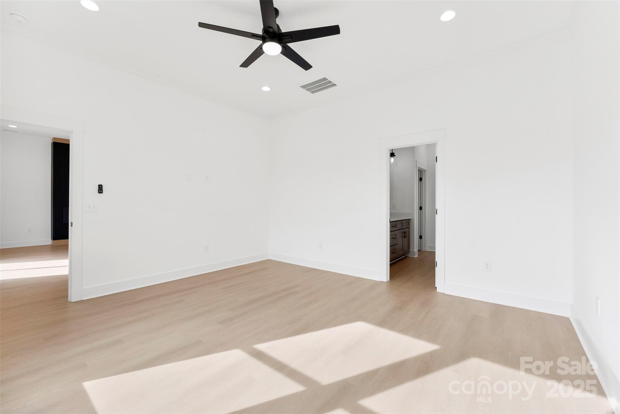 4085 Miller Road Salisbury, NC 28147 - Photo 22 of 46 a view of a room with wooden floor and ceiling fan