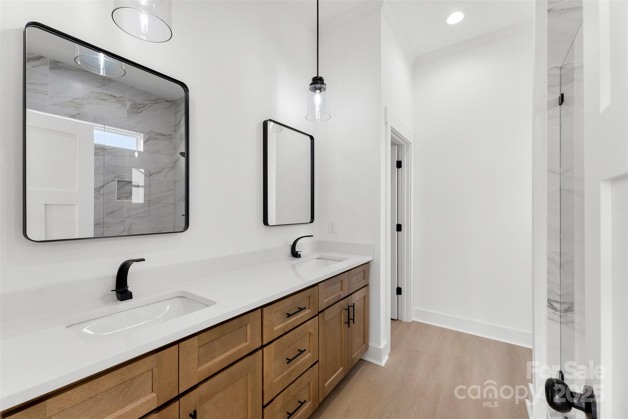 4085 Miller Road Salisbury, NC 28147 - Photo 23 of 46 a bathroom with a double vanity sink and mirror