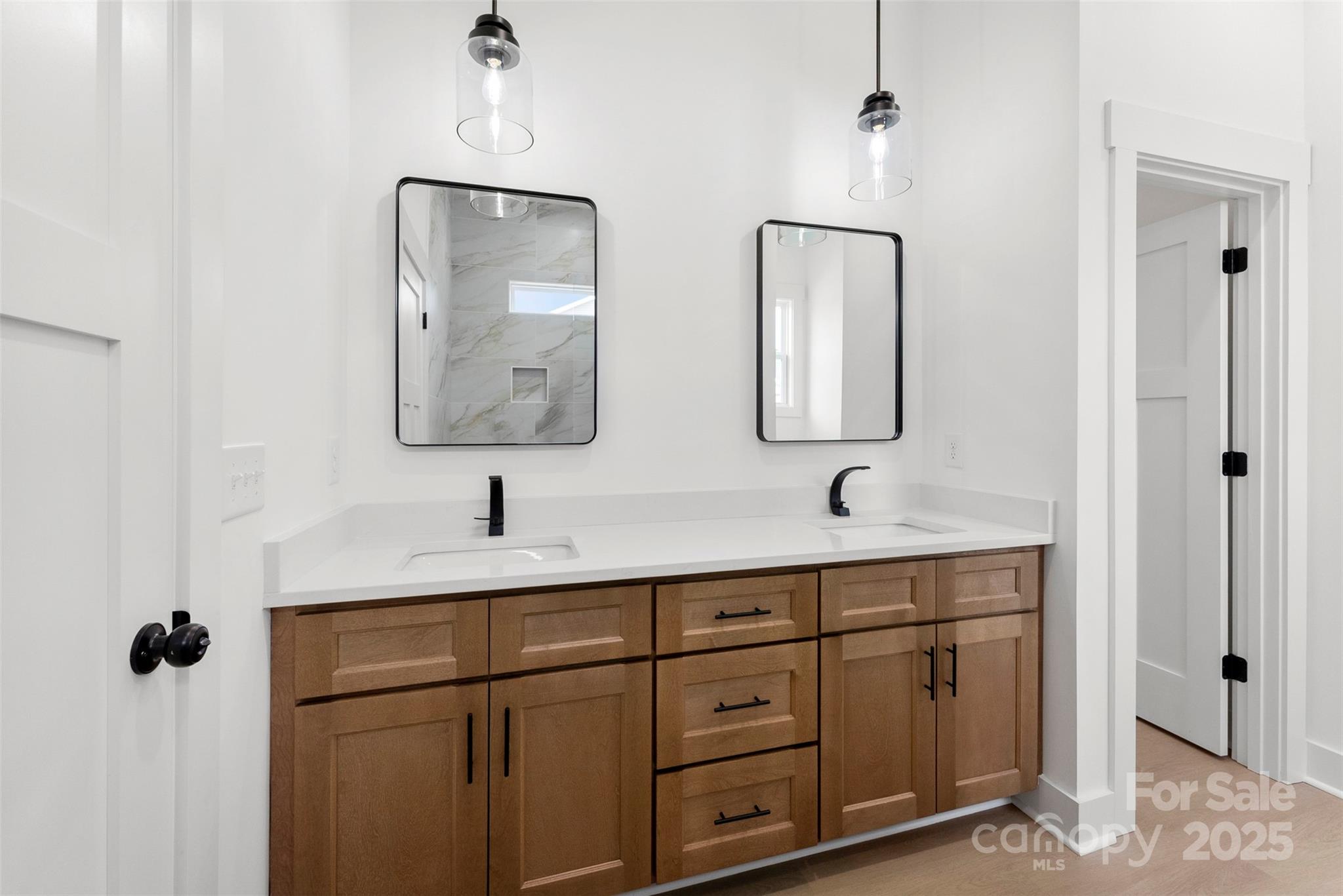 4085 Miller Road Salisbury, NC 28147 - Photo 25 of 46 a bathroom with a double vanity sink and mirror