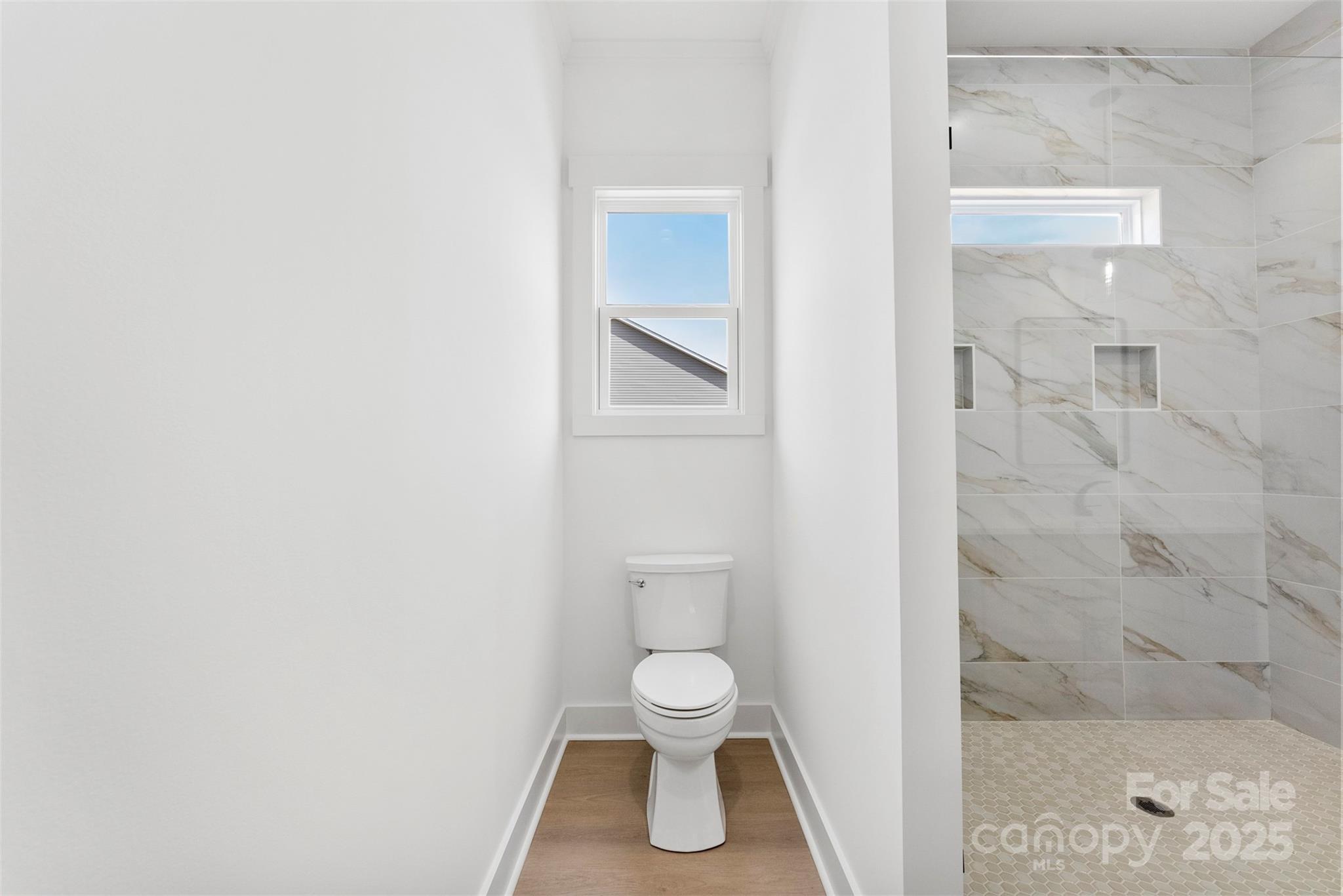 4085 Miller Road Salisbury, NC 28147 - Photo 26 of 46 a bathroom with a toilet and a shower