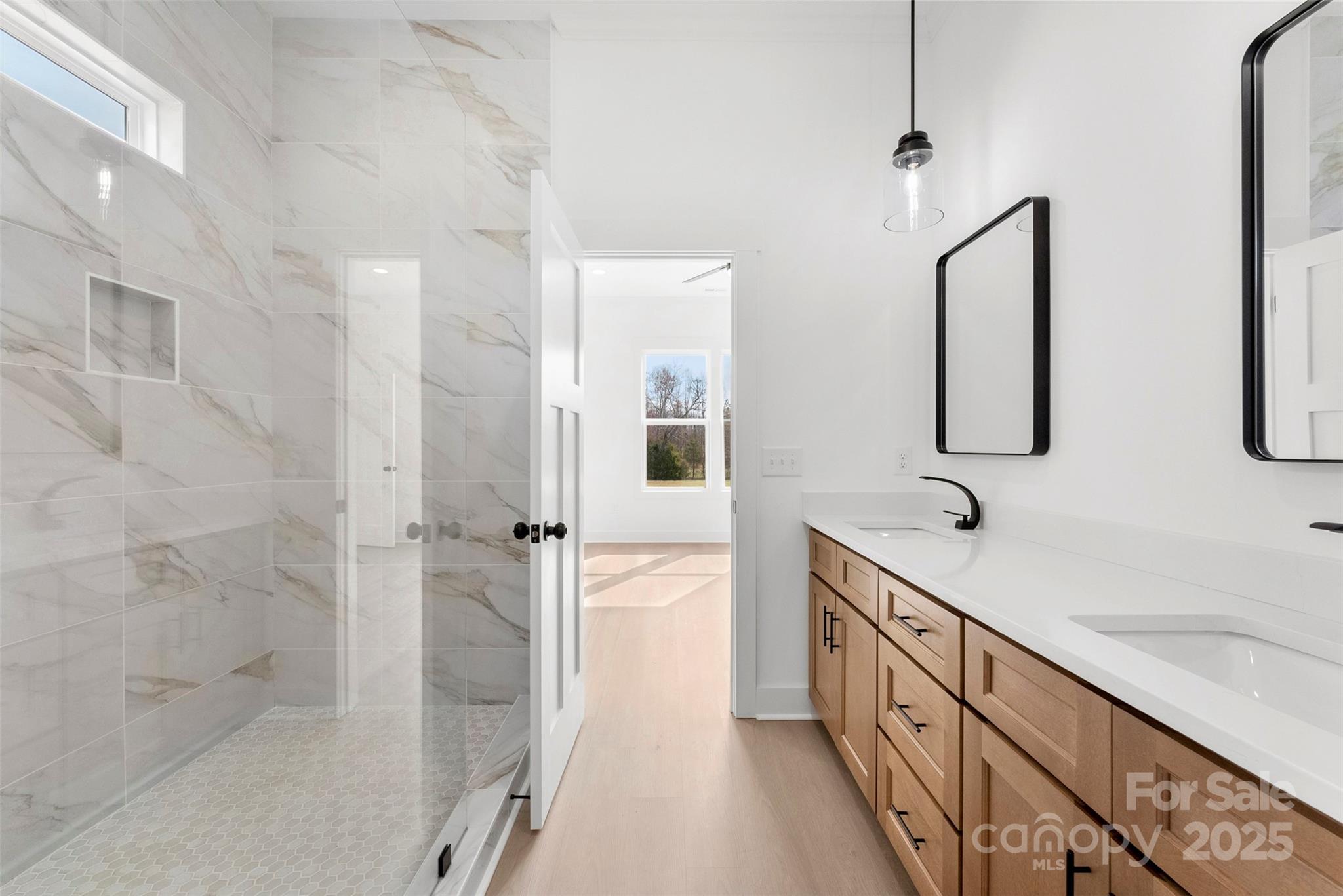 4085 Miller Road Salisbury, NC 28147 - Photo 29 of 46 a bathroom with a double vanity sink and mirror