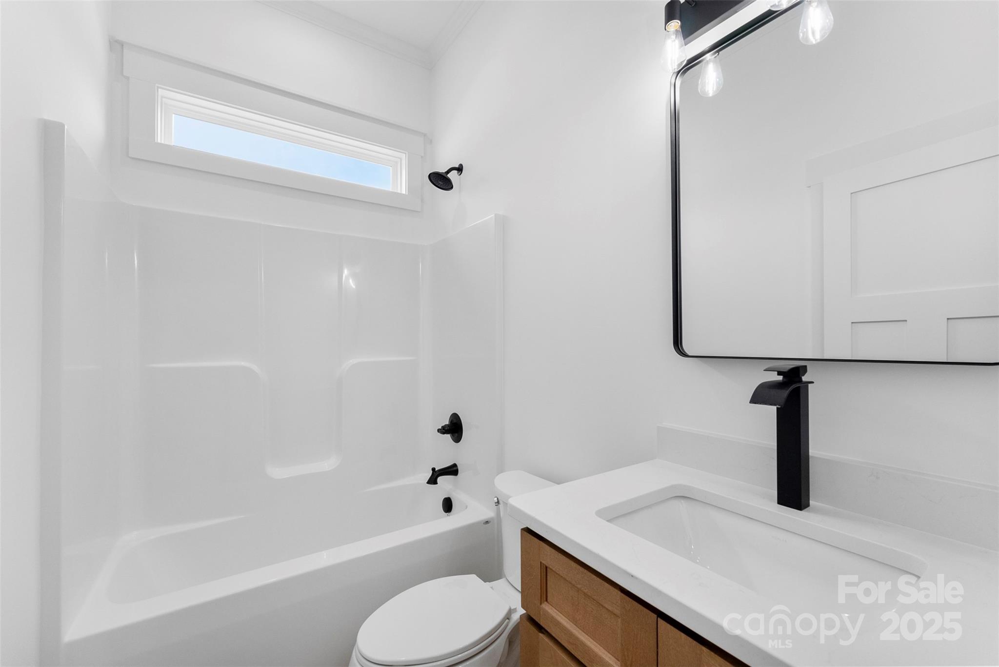 4085 Miller Road Salisbury, NC 28147 - Photo 33 of 46 a bathroom with a sink a toilet and a bathtub