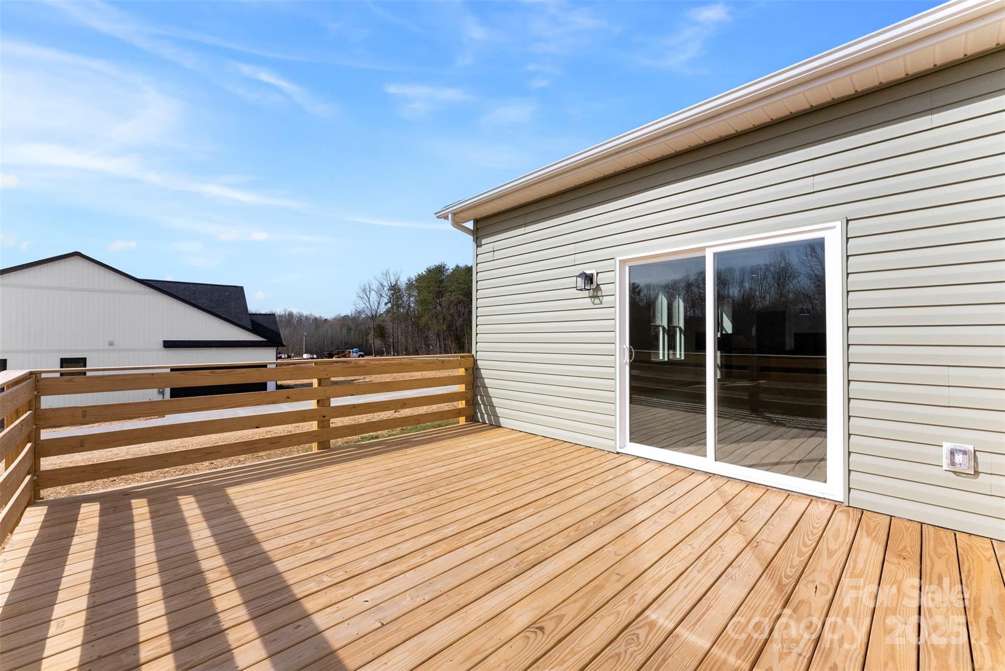 4085 Miller Road Salisbury, NC 28147 - Photo 40 of 46 a view of balcony with wooden floor and fence