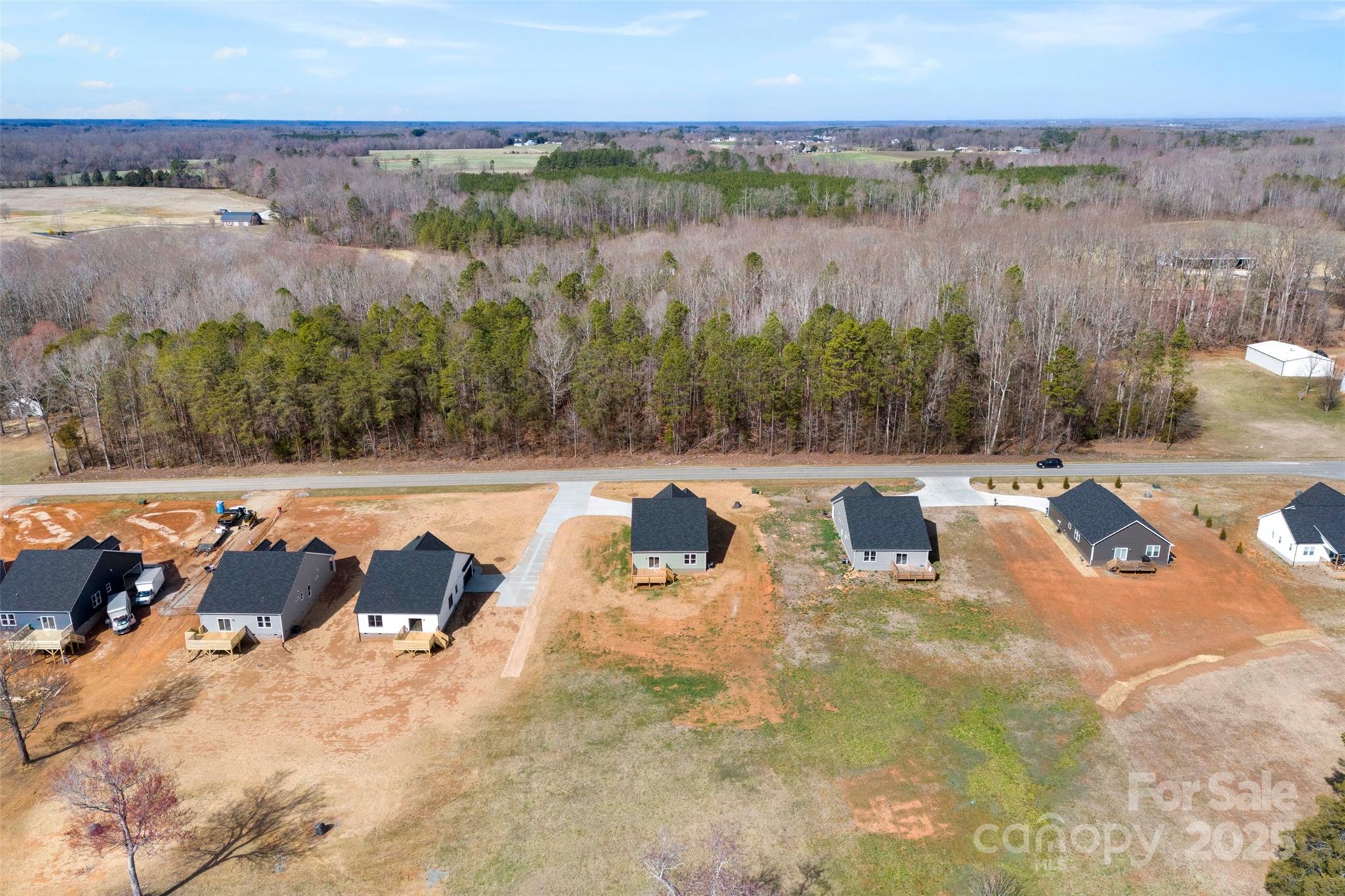 4085 Miller Road Salisbury, NC 28147 - Photo 42 of 46 an aerial view of a yard with horses
