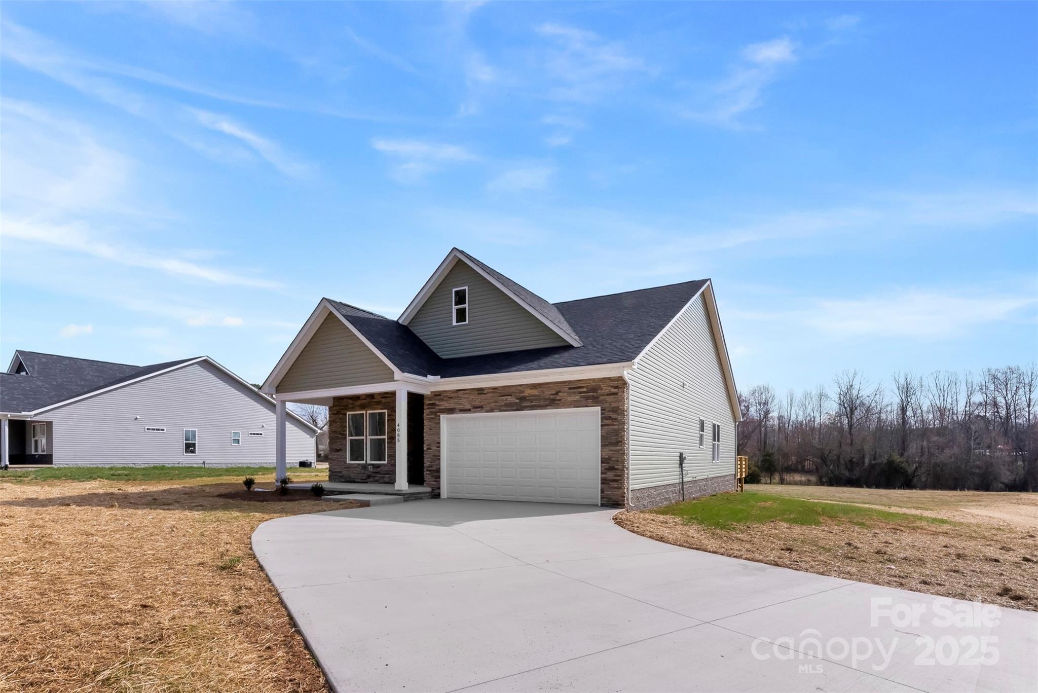 4085 Miller Road Salisbury, NC 28147 - Photo 46 of 46 a front view of a house with a yard and garage