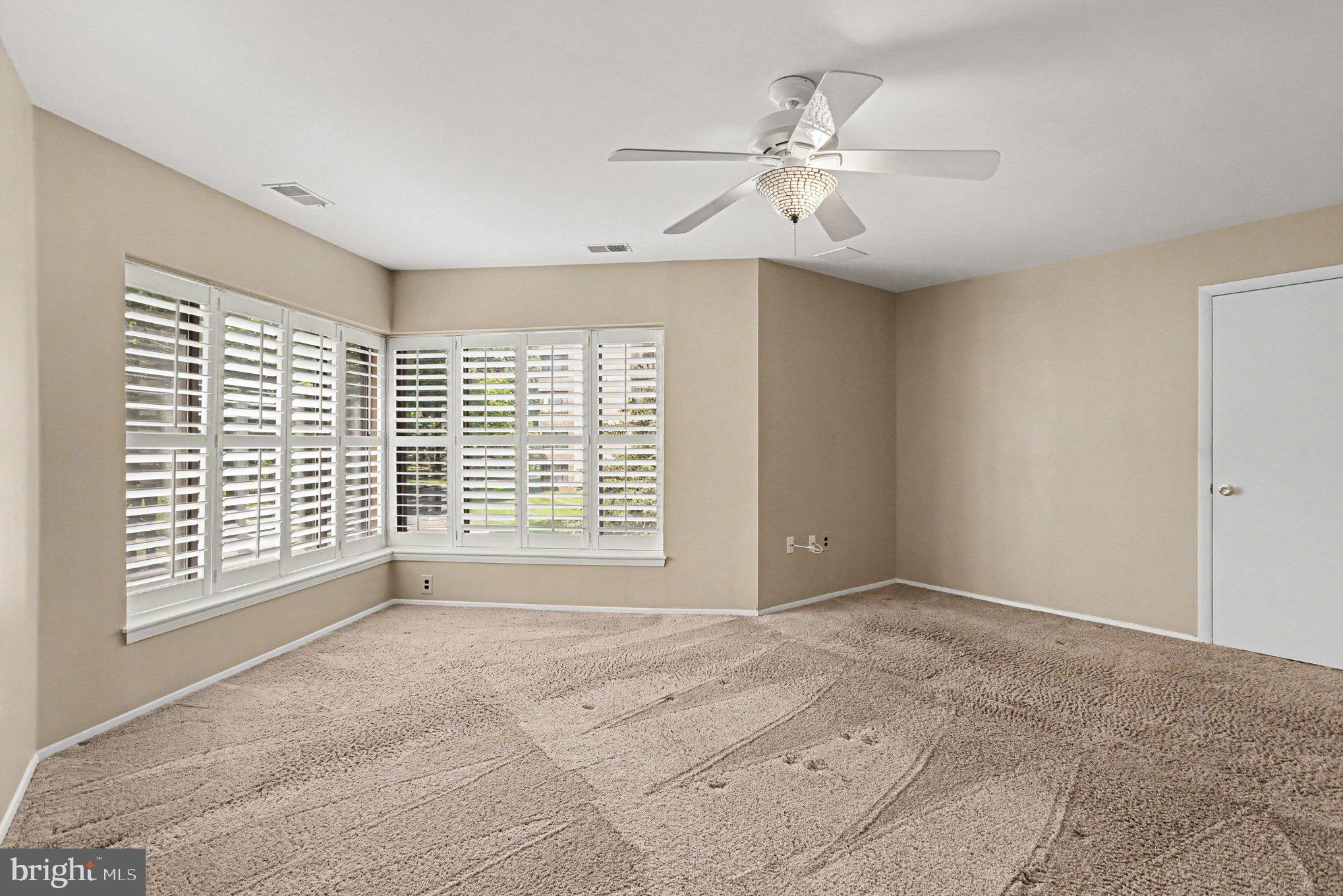 3021 Fallstaff Road, Unit 208B Baltimore, MD 21209 - Photo 17 of 25 a view of an empty room with a window