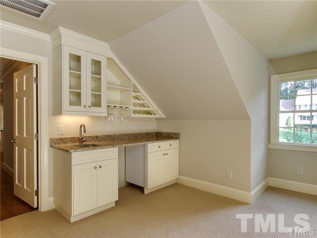 7003 North Ridge Drive Raleigh, NC 27615 - Photo 15 of 25 a view of granite countertop cabinets and sink