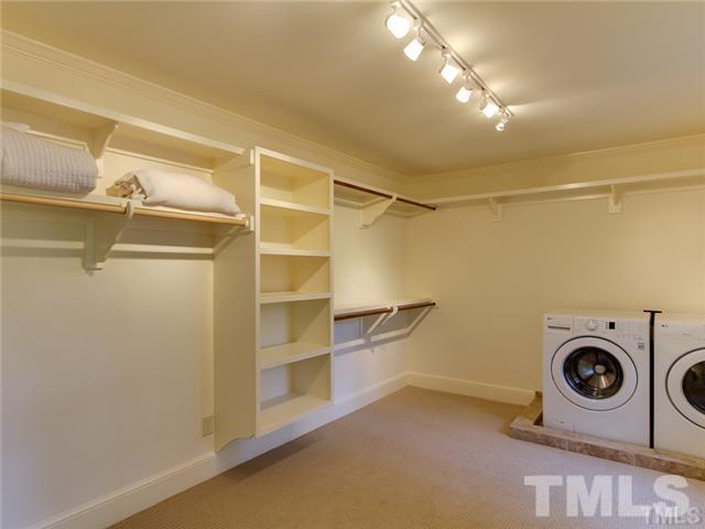 7003 North Ridge Drive Raleigh, NC 27615 - Photo 19 of 25 a view of walk in closet with empty racks