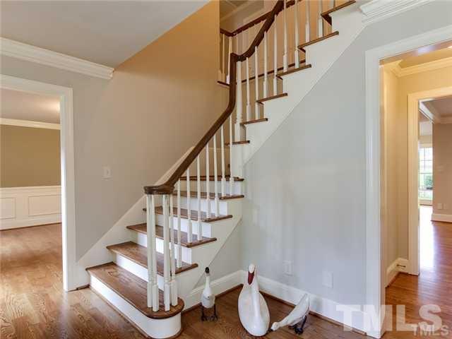7003 North Ridge Drive Raleigh, NC 27615 - Photo 8 of 25 a view of entryway and hall with wooden floor