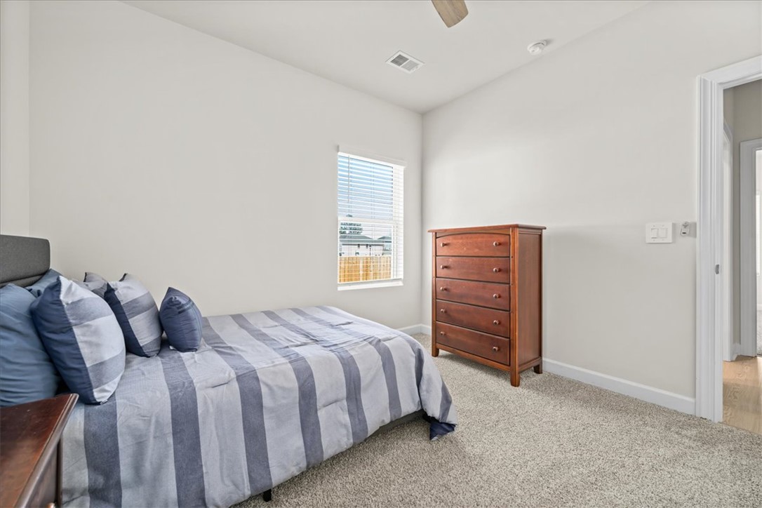 106 Purcell Way Easley, SC 29642 - Photo 33 of 39 This cozy bedroom features carpeted flooring and a window offering natural light.