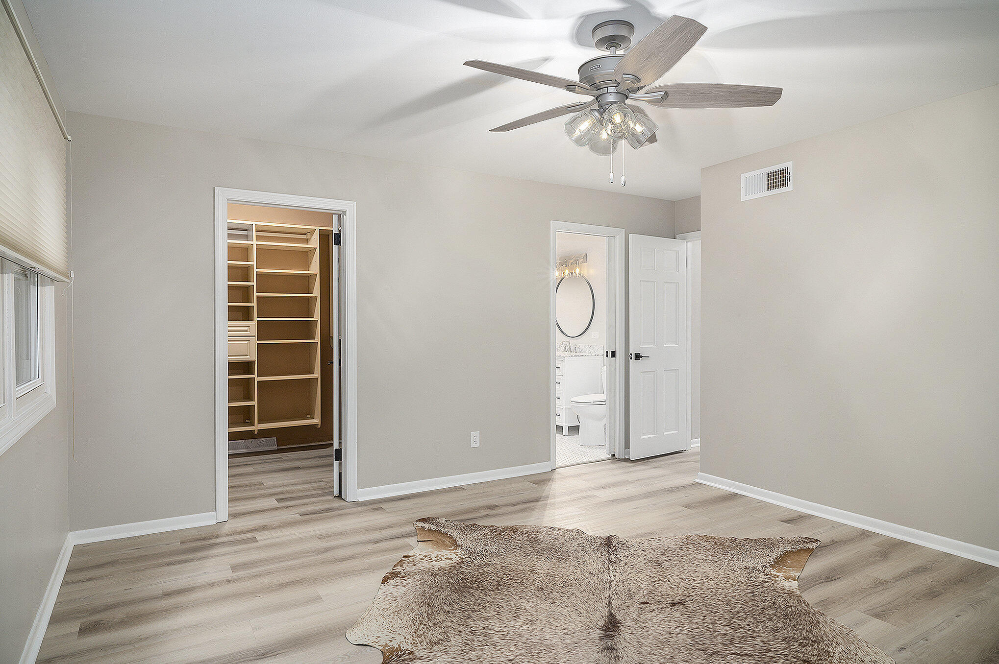 9307 Walnut Drive Munster, IN 46321 - Photo 19 of 26 an empty room with fan and windows