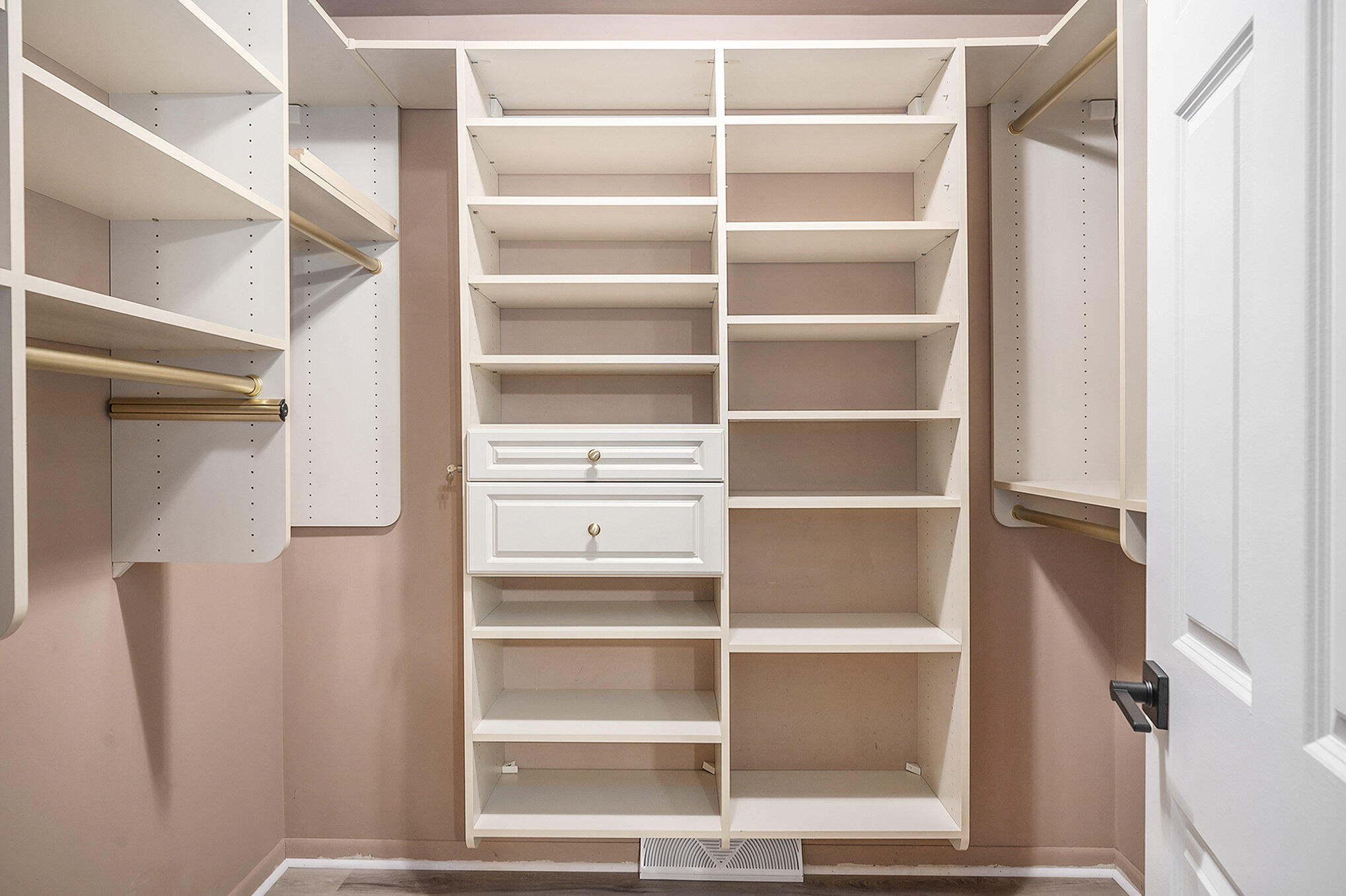 9307 Walnut Drive Munster, IN 46321 - Photo 20 of 26 a view of walk in closet with empty racks