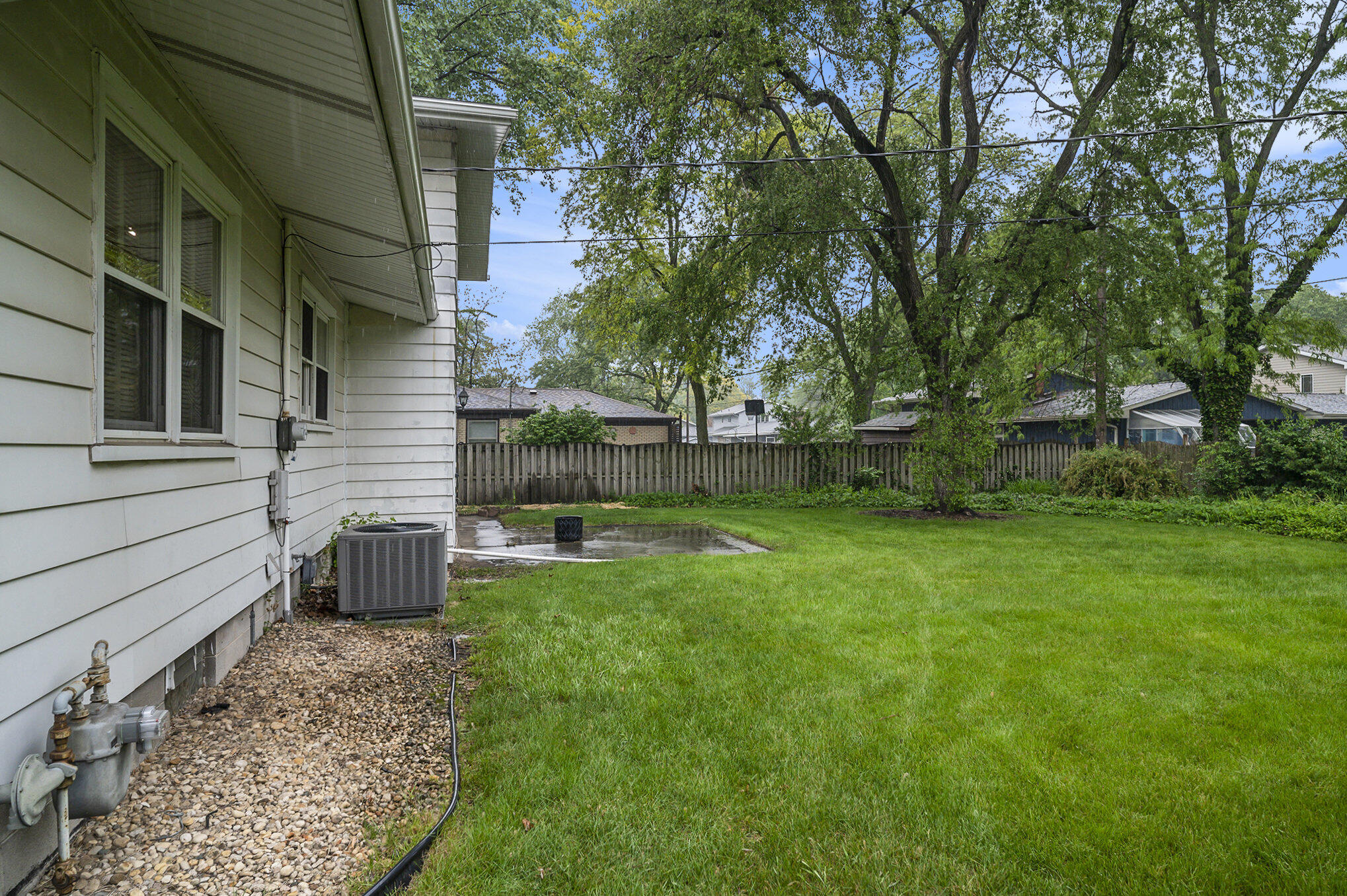 9307 Walnut Drive Munster, IN 46321 - Photo 22 of 26 a view of backyard with a tub and trees